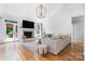 Bright and airy living room with a fireplace, hardwood floors, and a comfortable seating area at 3622 46Th Ne Ave, Hickory, NC 28601