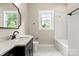 Classic bathroom featuring vanity with marble countertop and tiled shower-tub at 4015 Randolph Rd, Charlotte, NC 28211