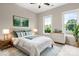 Bright, staged bedroom features modern furniture, stylish decor, and large windows at 4015 Randolph Rd, Charlotte, NC 28211