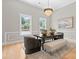 Charming dining room with natural light, a modern chandelier, and stylish furniture at 4015 Randolph Rd, Charlotte, NC 28211