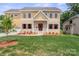 Charming two-story home featuring a brick and siding exterior, covered front porch, and well-manicured lawn at 4015 Randolph Rd, Charlotte, NC 28211
