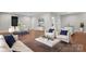Spacious living room features hardwood floors, modern furniture, stylish decor, and lots of natural light at 4015 Randolph Rd, Charlotte, NC 28211