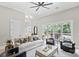 Spacious living room with sliding doors to a deck, and comfortable seating arrangement at 4015 Randolph Rd, Charlotte, NC 28211