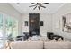 Inviting living room with a black fireplace, high ceilings, and ample natural light at 4015 Randolph Rd, Charlotte, NC 28211