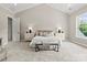 Serene main bedroom with vaulted ceilings, neutral tones, and natural light at 4015 Randolph Rd, Charlotte, NC 28211