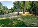 Well-maintained backyard with lush green grass and a black iron fence at 4017 Halyard Dr, Denver, NC 28037