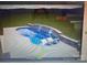 Rendering of an in-ground swimming pool with sun shelf loungers and a stone waterfall feature at 4017 Halyard Dr, Denver, NC 28037