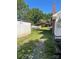 The long gravel driveway leads past a shed and covered parking area at 408 Moose St, Albemarle, NC 28001