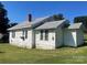 The back of the home shows white siding, grey roof, and green lawn at 408 Moose St, Albemarle, NC 28001