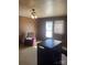 Living room with wood paneled walls, vintage heater, and natural light at 408 Moose St, Albemarle, NC 28001