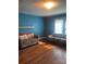 Living room featuring hardwood floors, a brick fireplace, and comfortable seating at 408 Moose St, Albemarle, NC 28001