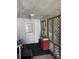 Enclosed porch area with lattice details and an outdoor ceiling fan at 408 Moose St, Albemarle, NC 28001