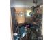 Cluttered storage room featuring shelving and various household items at 408 Moose St, Albemarle, NC 28001