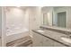Well-lit bathroom boasts a granite countertop, double sinks, shower and tub combo at 414 1St Avenue Se None, Hickory, NC 28602