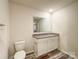 Bathroom featuring a modern vanity with granite countertop and wood-look flooring at 414 1St Avenue Se None, Hickory, NC 28602