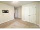 Bedroom featuring carpet, white walls, doors to closet and hallway at 414 1St Avenue Se None, Hickory, NC 28602