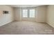 Spacious bedroom with neutral walls, carpet, and two windows for ample natural light at 414 1St Avenue Se None, Hickory, NC 28602
