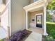 Close-up of the home's front porch with decorative brick accents and a well-manicured garden at 414 1St Avenue Se None, Hickory, NC 28602