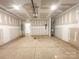 Spacious unfinished garage with concrete floor and ample room for parking and storage at 414 1St Avenue Se None, Hickory, NC 28602