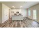 Bright kitchen featuring granite countertops, stainless steel appliances, and a center island at 414 1St Avenue Se None, Hickory, NC 28602