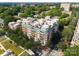 Aerial view of community buildings with green space and surrounding neighborhood at 415 N Church St # 311, Charlotte, NC 28202