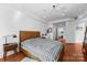 Bright bedroom featuring hardwood floors, recessed lighting, and a stylish ceiling fan at 415 N Church St # 311, Charlotte, NC 28202