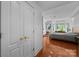 A bright bedroom featuring hardwood floors, recessed lighting, and a stylish ceiling fan at 415 N Church St # 311, Charlotte, NC 28202