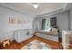 Bright Bedroom featuring a crib, daybed, and charming decor, creating a cozy space for children at 415 N Church St # 311, Charlotte, NC 28202