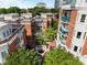 Community courtyard with manicured greenery and brick facade building at 415 N Church St # 311, Charlotte, NC 28202