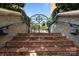 Brick stairs leading to a wrought iron gate at the entrance of this property at 415 N Church St # 311, Charlotte, NC 28202
