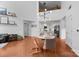 Open-concept living area with hardwood floors, modern lighting, and seamless access to the kitchen at 415 N Church St # 311, Charlotte, NC 28202