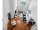 Open-concept living room with hardwood floors, a fireplace, and access to a balcony at 415 N Church St # 311, Charlotte, NC 28202