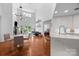 Bright, open-concept living space with modern furnishings, hardwood floors, and high ceilings at 415 N Church St # 311, Charlotte, NC 28202