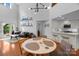 Open-concept living area with high ceilings, modern furnishings, and a view into the kitchen at 415 N Church St # 311, Charlotte, NC 28202