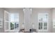 Bright bathroom featuring dual sinks, shuttered windows, pendant lighting, and neutral walls at 4237 Island Fox Ln, Denver, NC 28037