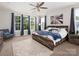 Bright bedroom with natural light, ceiling fan, and modern decor at 4237 Island Fox Ln, Denver, NC 28037