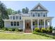 Charming two-story home featuring a welcoming front porch and landscaped front yard at 4237 Island Fox Ln, Denver, NC 28037