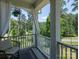 Cozy porch with neutral furniture, privacy curtains, and a scenic view at 4237 Island Fox Ln, Denver, NC 28037