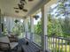 Spacious porch with outdoor furniture, fans, and hanging flower baskets at 4237 Island Fox Ln, Denver, NC 28037