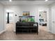 Hallway showcasing a built-in aquarium and access to multiple rooms in the home at 4237 Island Fox Ln, Denver, NC 28037