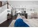 Open-concept living area with view of gourmet kitchen, dining area, and hardwood floors at 4237 Island Fox Ln, Denver, NC 28037