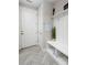 Organized mudroom with a built-in bench, coat hooks, and storage shelves at 4237 Island Fox Ln, Denver, NC 28037