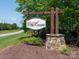 Stone base and wooden framed community sign for the Fox Chase neighborhood at 4237 Island Fox Ln, Denver, NC 28037