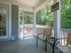 Relaxing screened porch with seating, perfect for enjoying the outdoors and backyard views in comfort at 4237 Island Fox Ln, Denver, NC 28037