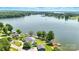 Aerial view of lakefront property with lush landscaping, private dock, and serene waterfront setting at 441 Wildlife Club Ln, Taylorsville, NC 28681