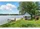 Picturesque gazebo by the lake with a private dock, offering a serene outdoor retreat at 441 Wildlife Club Ln, Taylorsville, NC 28681