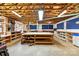 Expansive basement workshop area featuring open ceilings, work benches, and ample storage at 441 Wildlife Club Ln, Taylorsville, NC 28681