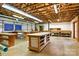 Spacious basement workshop with multiple workbenches and storage, perfect for projects and hobbies at 441 Wildlife Club Ln, Taylorsville, NC 28681