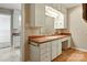The bathroom vanity features a sink, a mirror, and plenty of storage cabinets at 441 Wildlife Club Ln, Taylorsville, NC 28681