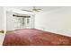 Spacious bedroom featuring a bay window and red carpet, perfect for relaxation at 441 Wildlife Club Ln, Taylorsville, NC 28681